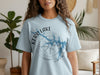 Light blue t-shirt with Kerr Lake Virginia map in blue watercolor and compass design
