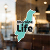 Turquoise Moraine Life sticker with text on a window.