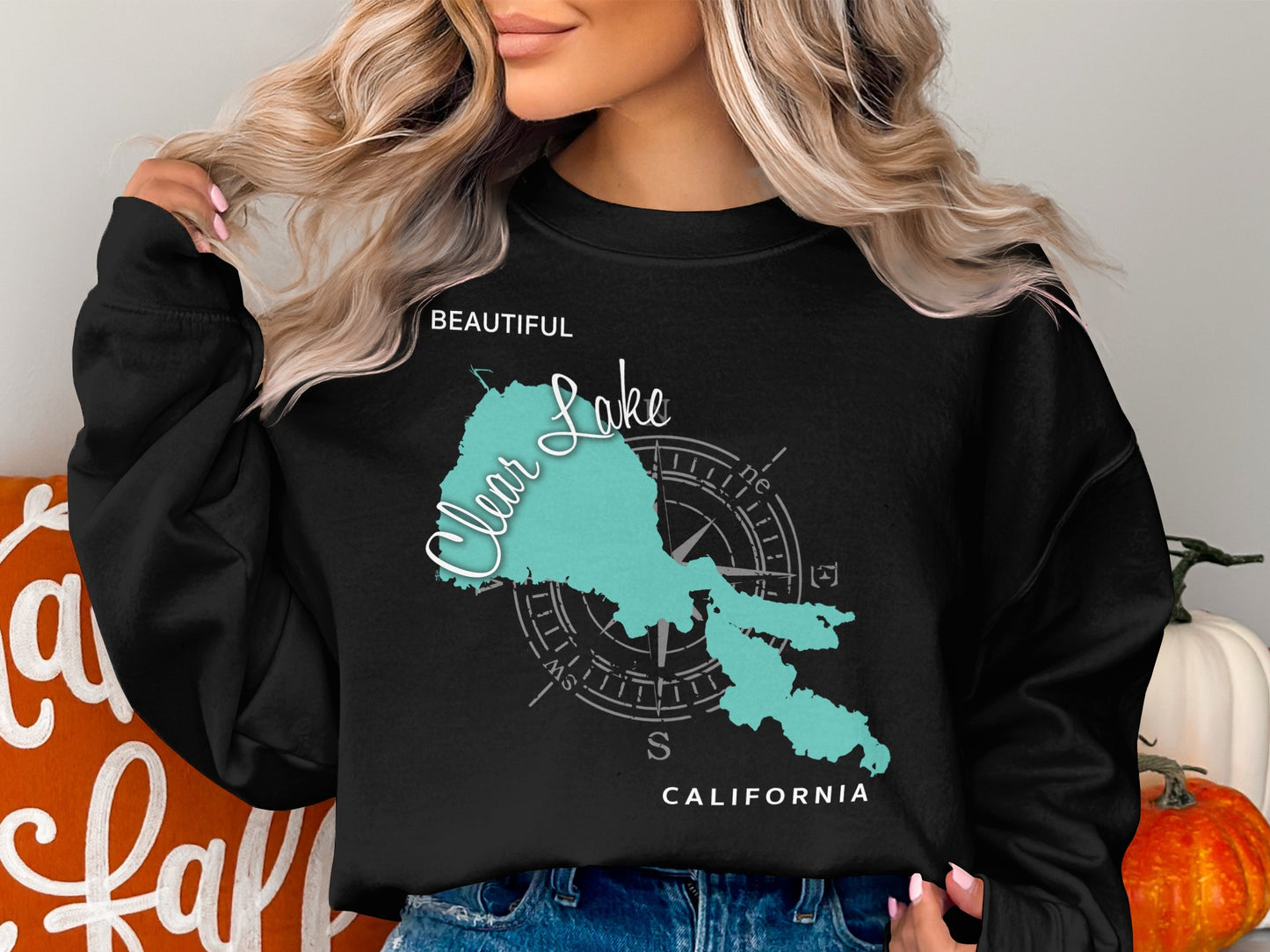 Black sweatshirt with a turquoise Clear Lake, California map and compass graphic.