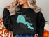 Black sweatshirt with a turquoise Clear Lake, California map and compass graphic.