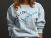 Light blue sweatshirt with Hyco Lake map and compass graphic.