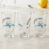 Three clear pint glasses featuring Weiss Lake, Alabama map and compass design.