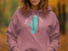 Pink hoodie featuring a teal map of Lake Winnebago and compass graphics.
