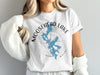 White t-shirt with Moosehead Lake Maine graphic and compass rose design.