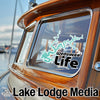 Wedowee Life sticker on a wooden boat with "Lake Lodge Media" text.