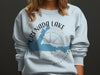 Light blue sweatshirt with Grenada Lake Mississippi map and compass graphic.
