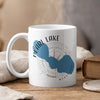 White mug with blue Pearl Lake shape, compass, and text.