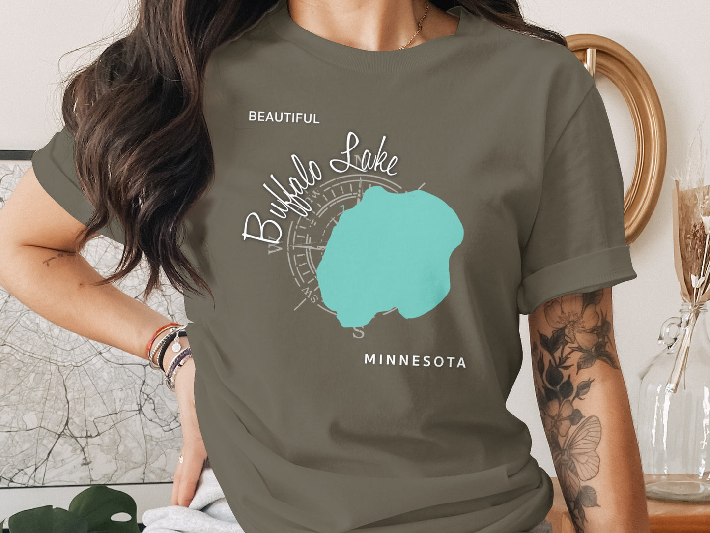 Brown t-shirt with a turquoise Buffalo Lake map and compass graphic.