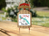 Sled ornament with "Merry Christmas FROM Bass Lake" text and lake graphic.