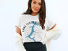 White t-shirt with Lake Coeur d'Alene map, compass, and Idaho text.