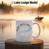 White mug with "Fort Peck Lake Montana" text and compass rose graphic.