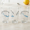 Three glasses with Woods Canyon Lake design and compass rose graphic.