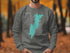Gray sweatshirt with Trout Lake map and compass graphic.
