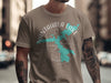 T-shirt with Nantahala Lake shape design and compass on taupe fabric.