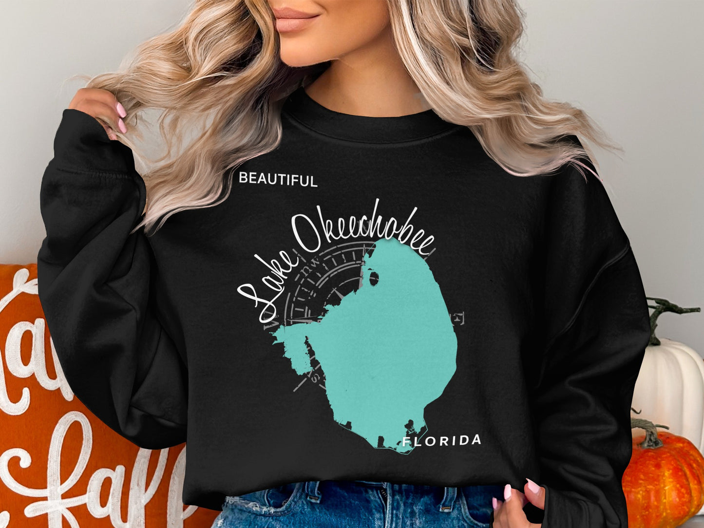 Black sweatshirt with teal Lake Okeechobee map and compass rose.