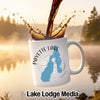 White mug with "Payette Lake Idaho" text and lake outline, coffee splashing.