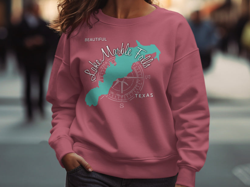 Teal map of Lake Marble Falls, Texas on a pink sweatshirt.