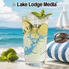 Tall glass with Lake Lanier map and compass design on beach background.