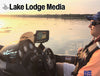 Fishing boat at sunset with logos "Lake Lodge Media" and "Norris Life"