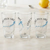 Three clear glasses display "Fort Peck Lake Montana" with compass rose and lake map designs.