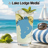 Glass with Istokpoga lake outline, mint, lime, and ice on beach with sailboat.