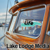 Donner Life logo on a boat window with Lake Lodge Media branding.