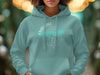 Teal hoodie with "Enid Lake Mississippi" compass design and lake outline.