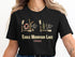 T-shirt with "Eagle Mountain Lake Texas" text and lake-themed graphics.