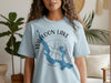 Light blue t-shirt with "Walloon Lake Michigan" text and lake outline graphic.