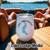 A white stainless steel tumbler featuring Lake Sammamish graphic branding sits on a boat table.