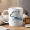 White mug with Rathbun Lake Iowa map and compass design, steaming.
