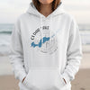 White hoodie with Cedar Lake Ontario map and compass design at center chest.
