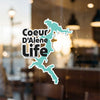 Coeur D'Alene Life sticker with lake outline, on a window.
