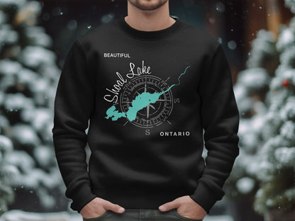 Black sweatshirt with a teal graphic of Shoal Lake and a compass rose.