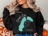 Black sweatshirt with Grand Lake Colorado map and compass graphic.