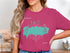 Pink t-shirt with teal Grand Lake St. Marys and compass graphic.