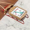 Wooden sleigh ornament with "Merry Christmas from Keechelus Lake" text.