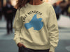 Light yellow sweatshirt with a blue map of Lake Mendota, Wisconsin, and compass graphic.