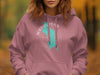 Adult-sized dusty rose hoodie with a teal map outline and compass graphic.