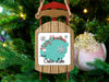 Wooden sled ornament with "Merry Christmas From Crater Lake" and snowflakes.