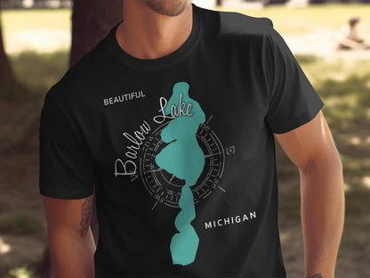 Black t-shirt with a teal compass rose design showing Barlow Lake, Michigan.