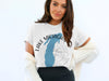 White t-shirt with "Lake Michigan" text, a blue outline of the lake, and a compass graphic.