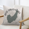 Pillow with Rose Canyon Lake map and Arizona text, on a chair.
