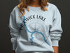 Light blue sweatshirt with a map of Pickwick Lake and compass graphic.