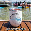 White insulated wine tumbler with a Lake Murray compass design, sitting on a wooden boat deck.