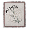 Woven blanket featuring Lake Oconee map and compass design with Georgia text.