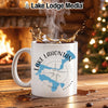 White mug with Lake Lahontan map and compass design, steaming coffee splash.