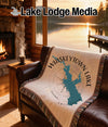 Woven throw blanket featuring a blue silhouette map of Whiskeytown Lake, California.