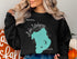 Black sweatshirt with turquoise Lake Istokpoga map and "Beautiful Florida" text.