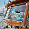 "Chautauqua Life" logo sticker on a boat window, "Lake Lodge Media" text below.